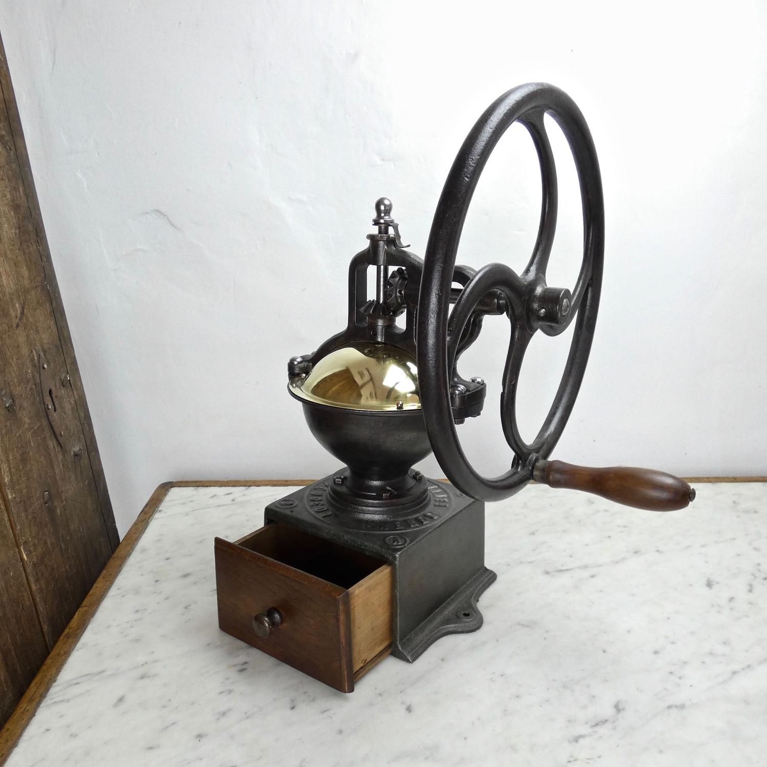 Peugeot coffee mill with wheel.