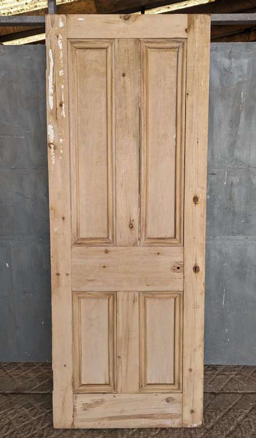DI0874 A RECLAIMED 4 PANEL STRIPPED PINE INTERNAL DOOR