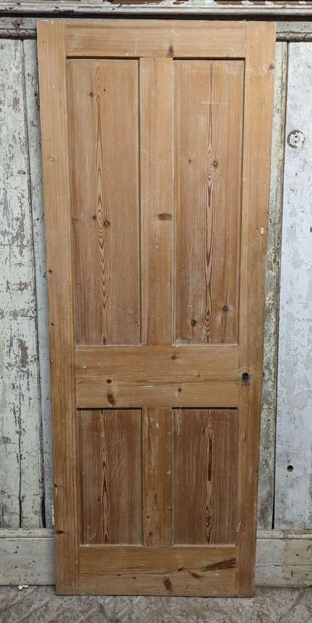 DI0907 A RECLAIMED 4 PANEL STRIPPED PINE INTERNAL DOOR