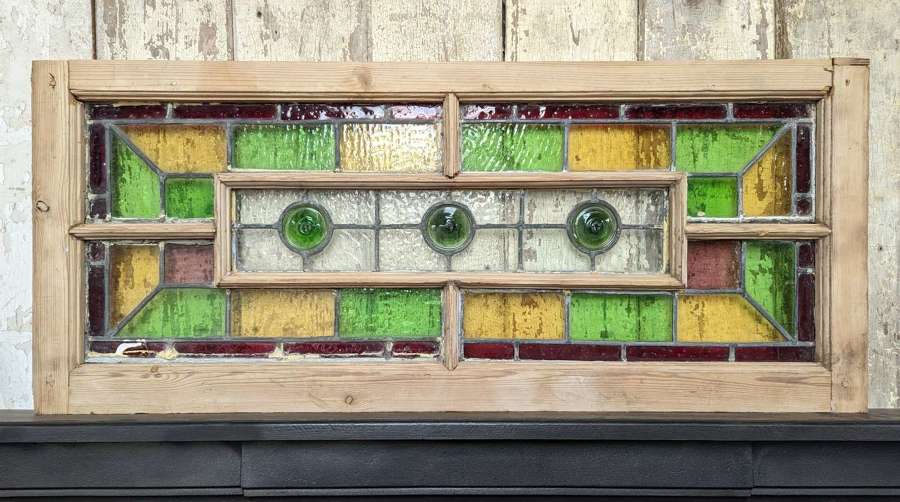M1967 A RECLAIMED ANTIQUE STAINED GLASS WINDOW WITH PINE FRAME