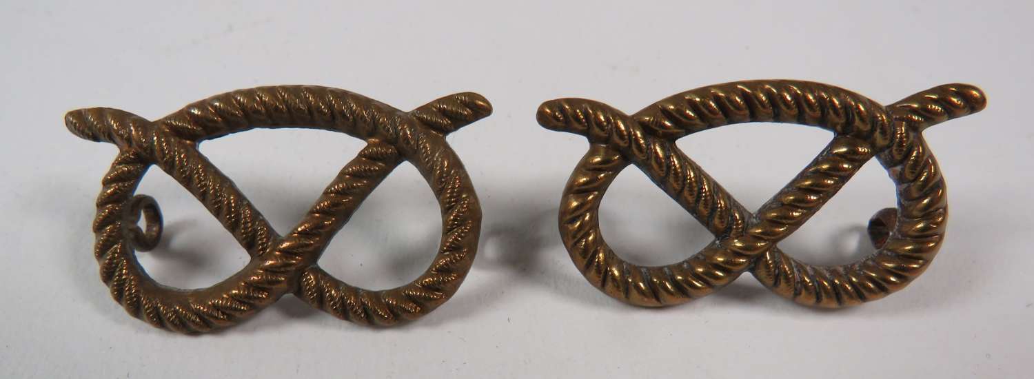 Pair of South Stafford Collar Badges