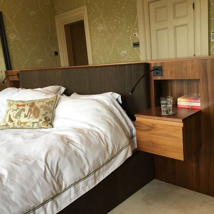 Bespoke furniture to place the bed in the centre of the room