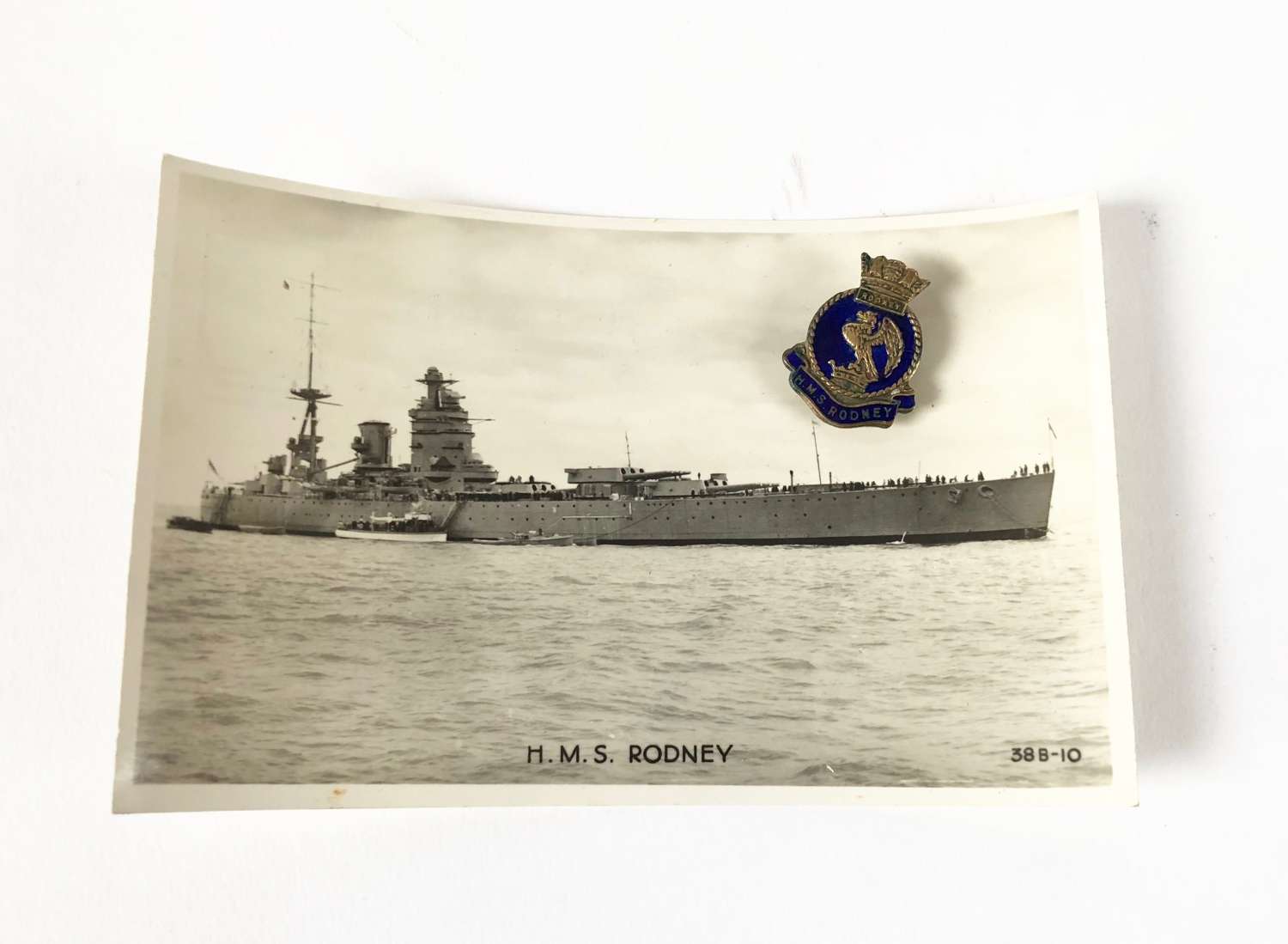 HMS Rodney Lapel Badge and Postcard.