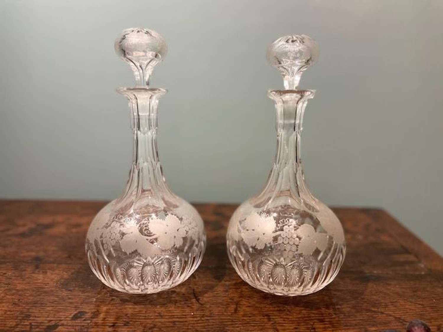 Pair of mid 19th c. Shaft & Globe decanters with grapevine motifs