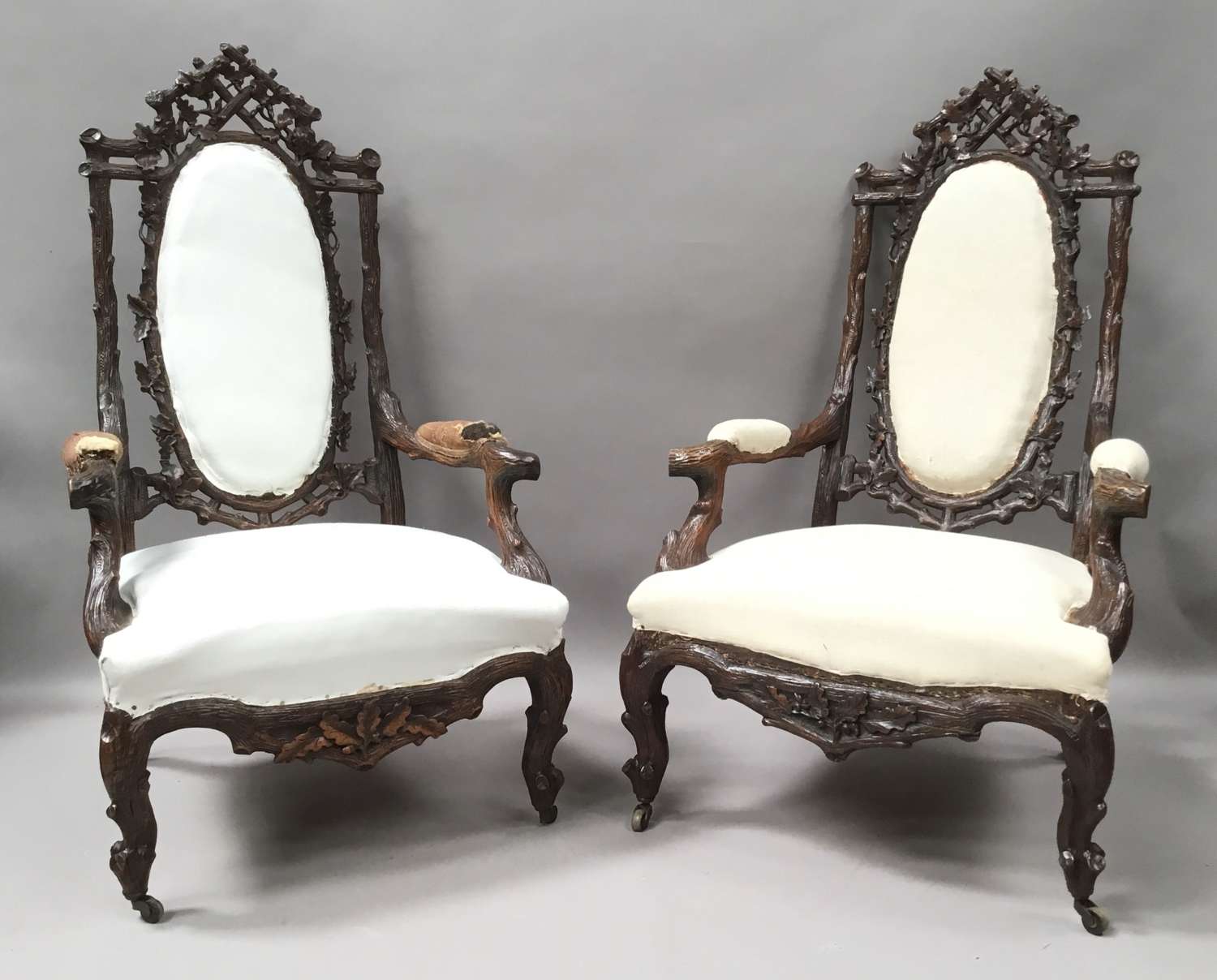 C19th pair of Black Forest open armchairs