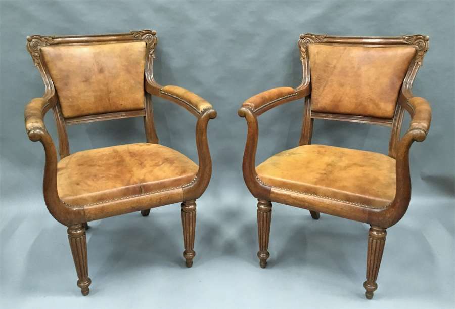 Regency pair of oak and leather library chairs