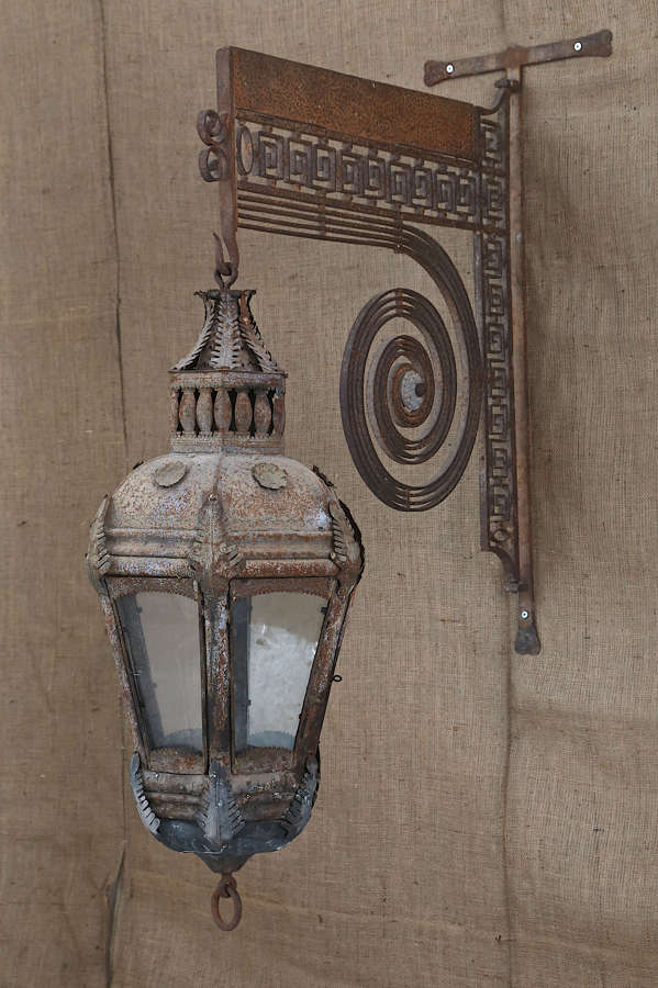 18th century French Tole lantern on a wrought iron wall bracket