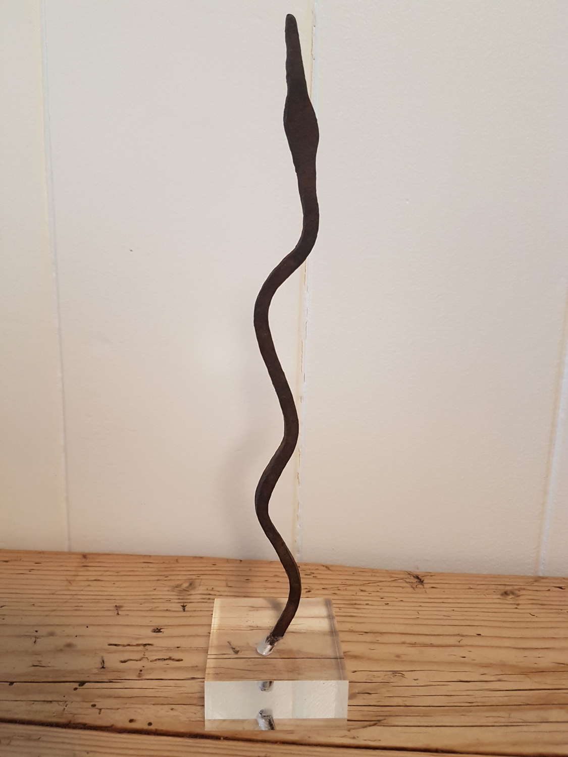 Lobi Iron Snake Currency on lucite stand - pointed head