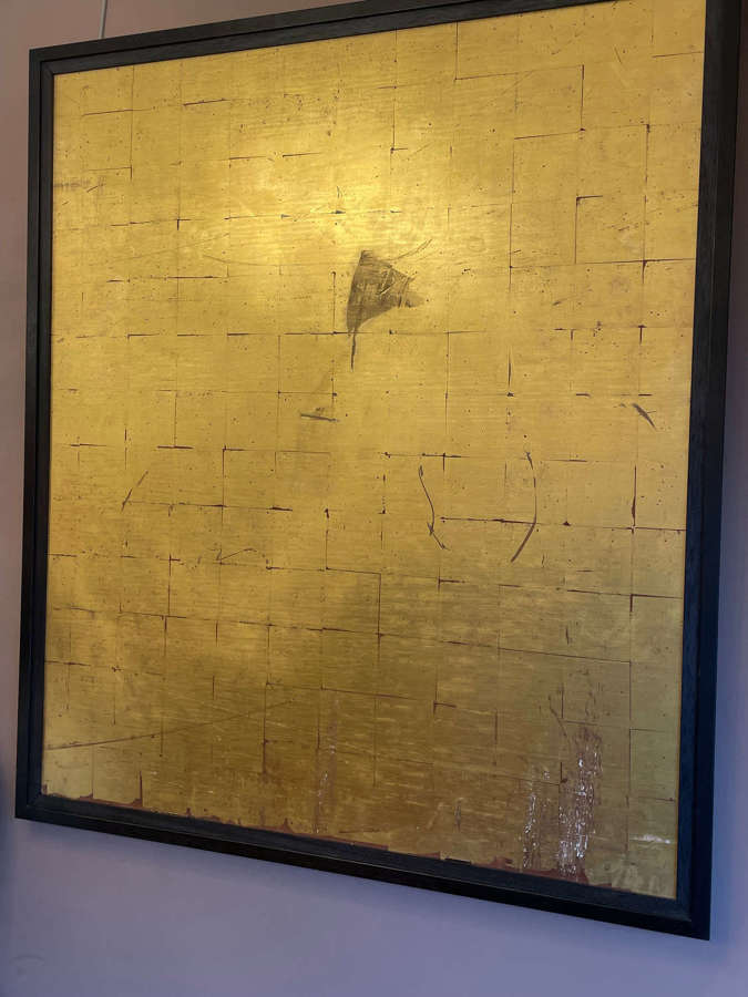An artists framed book leaf gilded panel