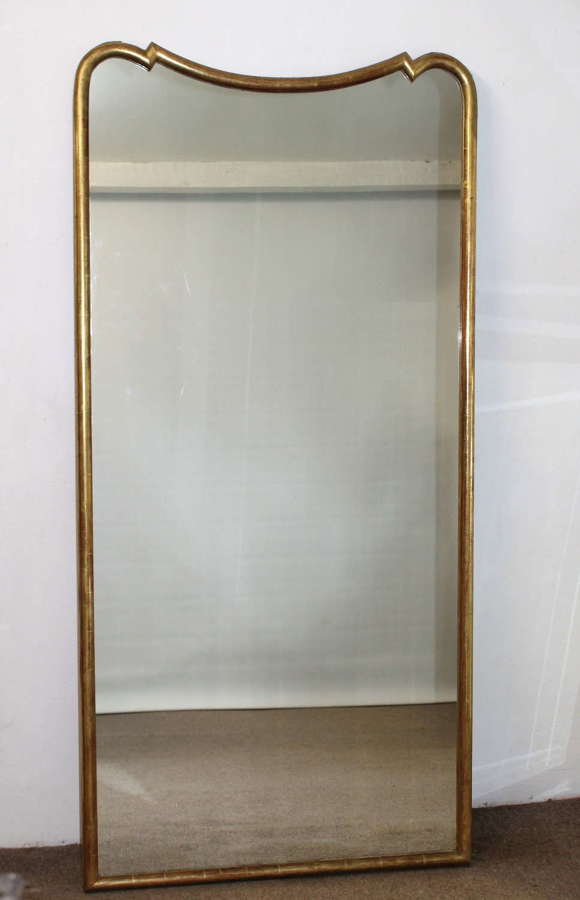 Tall antique French gilt mirror with incurved top