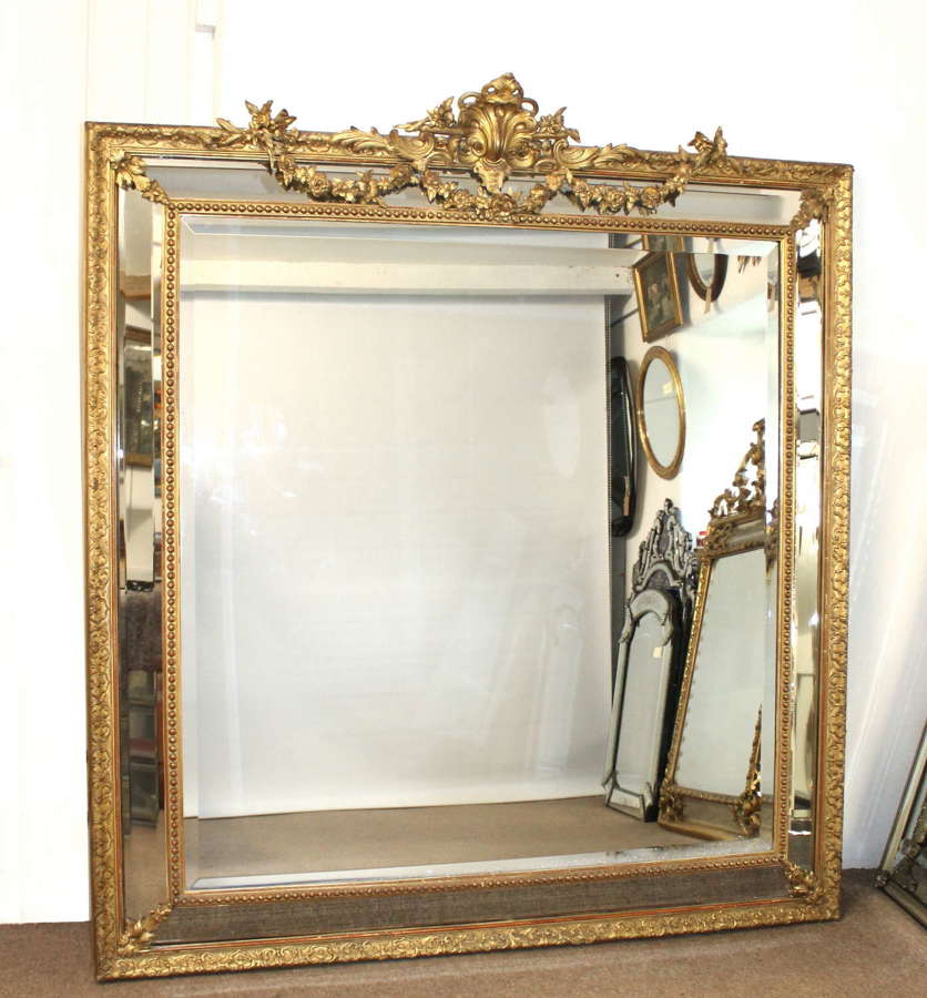 Magnificent very large antique French decorative cushioned mirror