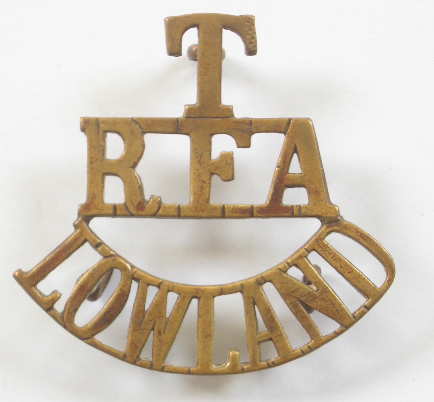 T/RFA/LOWLAND brass shoulder title