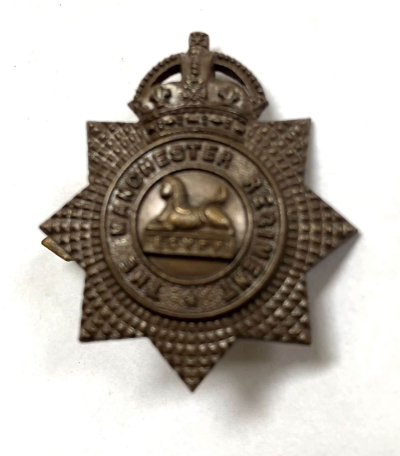 Manchester Regiment OSD bronze field service cap badge