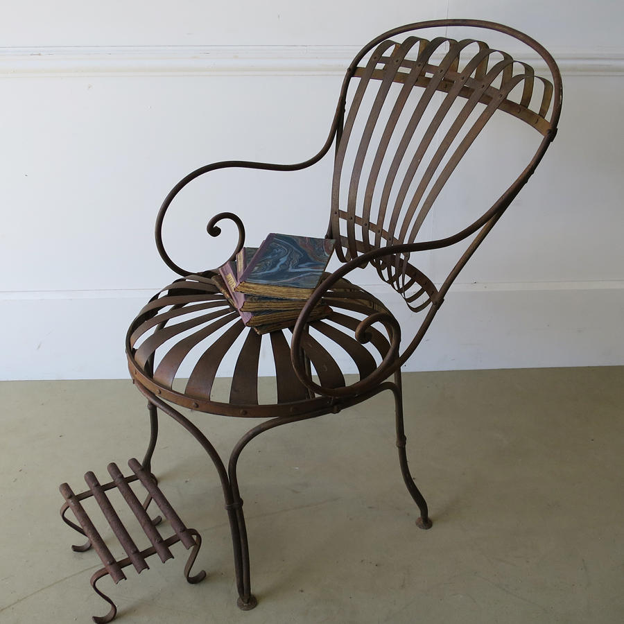 Single Iron sprung arm chair with footstool circa 1880