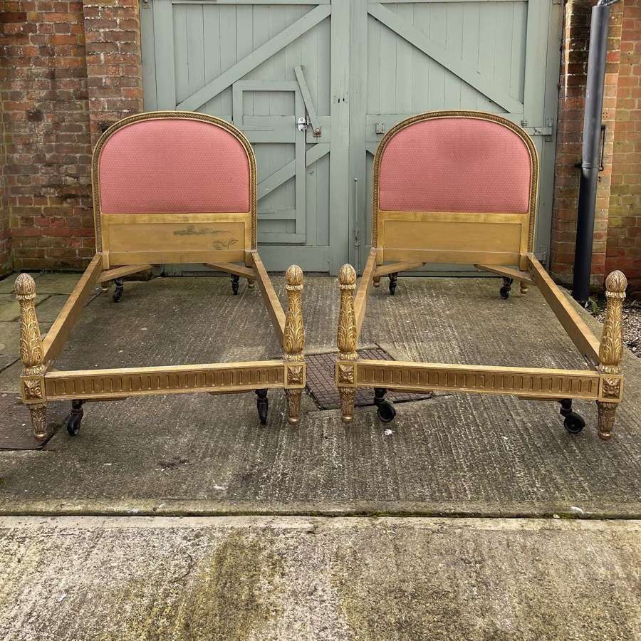 A pair of 19th century gilt wood beds