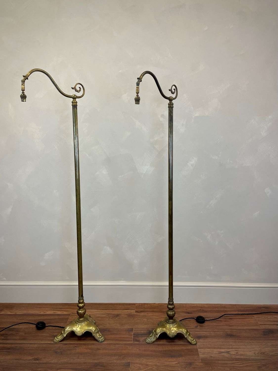 Pair of elegant brass floor lamps